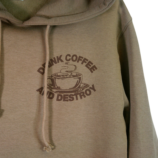close up image of small brown right chest print of a cup of hot coffee. above it says drink coffee, and below it says and destroy